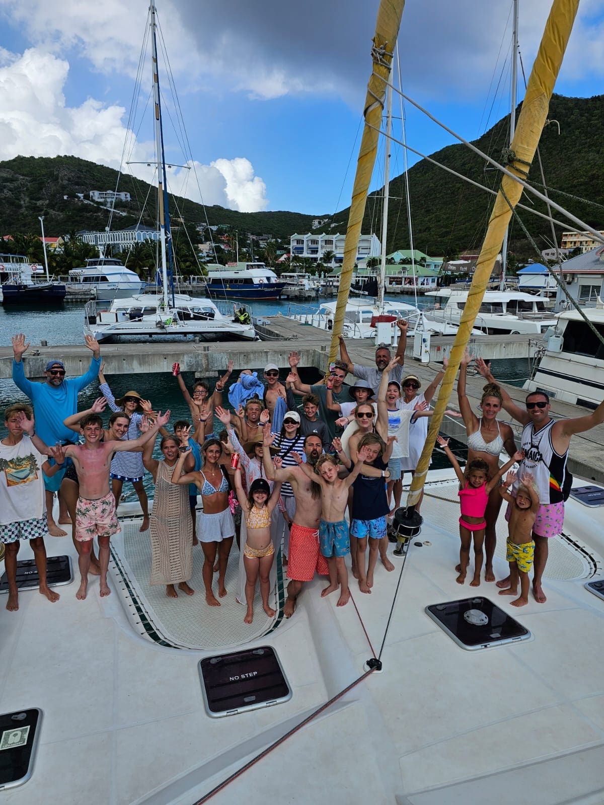 Aerial view of The Phoenix sailing along the St. Maarten coastline on a private charter
